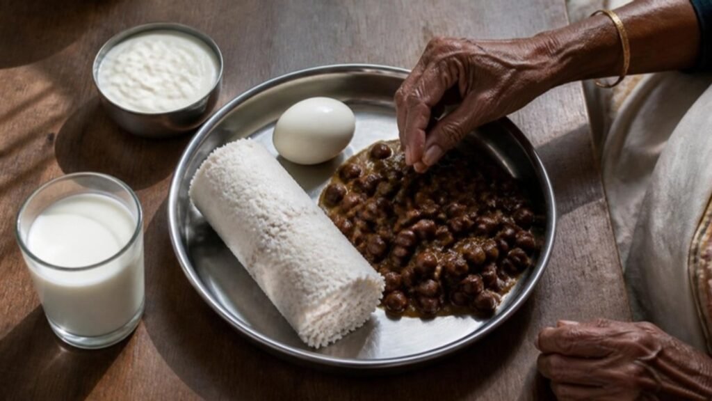 A Kerala breakfast of puttu, kadala curry, egg, curd and milk